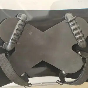 Anti riot shield with baton holder